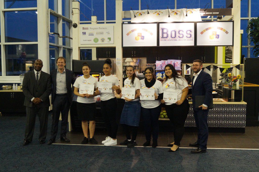 (l-r) Milwaukee County CBDP Director Rick Norris; County Executive Chris Abele; student entrepreneurs Ruth Arias, Desteny Cruz, Joselena Ortiz, Islena Zepada and Karina Reyes; and BOSS Program Director Pete Bellavia celebrate the demonstration of the students' business concept, Yummy Care, earlier this week at General Mitchell International Airport. Photo from Milwaukee County.