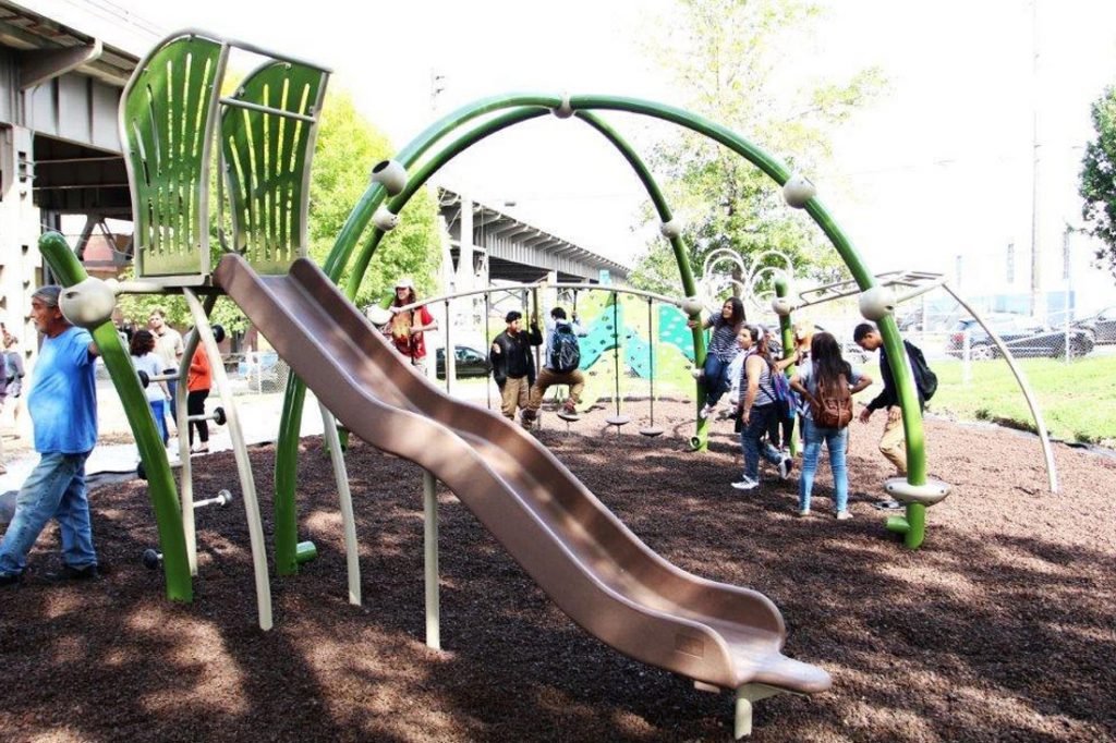 Neighborhood kids check out the new playground at the opening of the newly renovated Arlington Heights Park in September 2015. Photo courtesy of Zilber Family foundation.