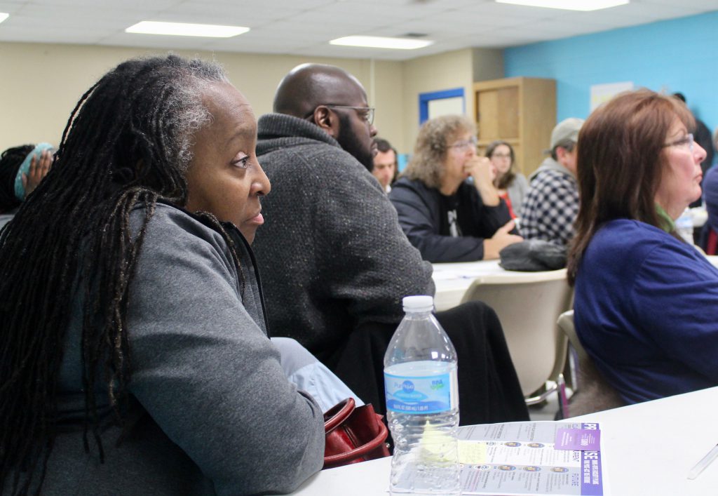 Gwendolyn Bivins, a middle school teacher and Milwaukee County resident, listens to the county’s presentation on its newly proposed youth secure residential facility. Photo courtesy of NNS.