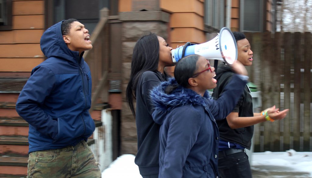 Jashanti Johnson leads the march from the front, shouting chants into the megaphone. Photo by Allison Dikanovic/NNS.