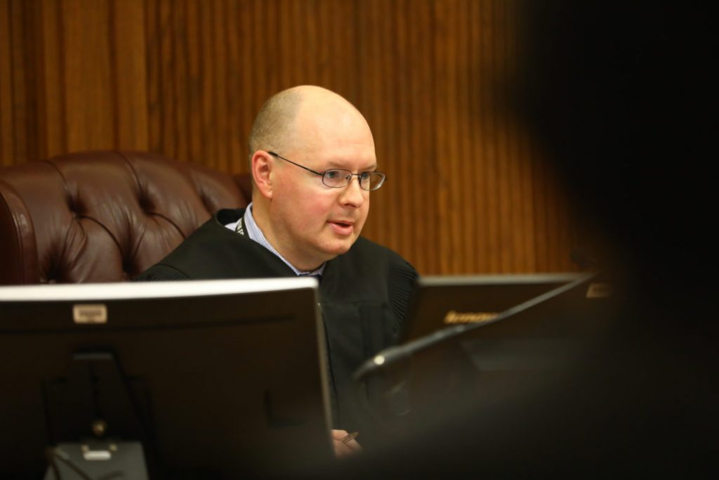 Dane County Circuit Court Commissioner Brian Asmus makes bail decisions at the Dane County Public Safety Building on May 25, 2018. Asmus says whether to set cash bail for defendant Eddie Armstrong was a “close call.” Armstrong faced multiple misdemeanors and failed to appear for court once before, but a risk assessment recommended he be released on a signature bond with no conditions. Asmus followed the recommendation. Photo by Coburn Dukehart/Wisconsin Center for Investigative Journalism.