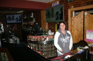 Debbie Dean behind the bar at Neighborhood Bar. Photo courtesy of Warren Johnston.