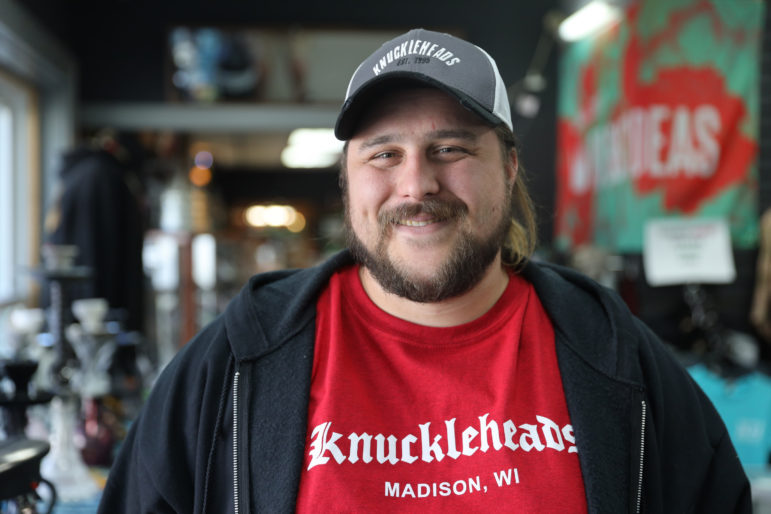 Landon Meske, general manager of Knuckleheads, a CBD and vape shop in Madison, Wis., is seen in his shop on April 15, 2019. Meske notes that most Wisconsinites favor legalizing marijuana. “It’s disappointing that we don’t have representatives that are listening,” he says. Photo by Emily Hamer / Wisconsin Center for Investigative Journalism.