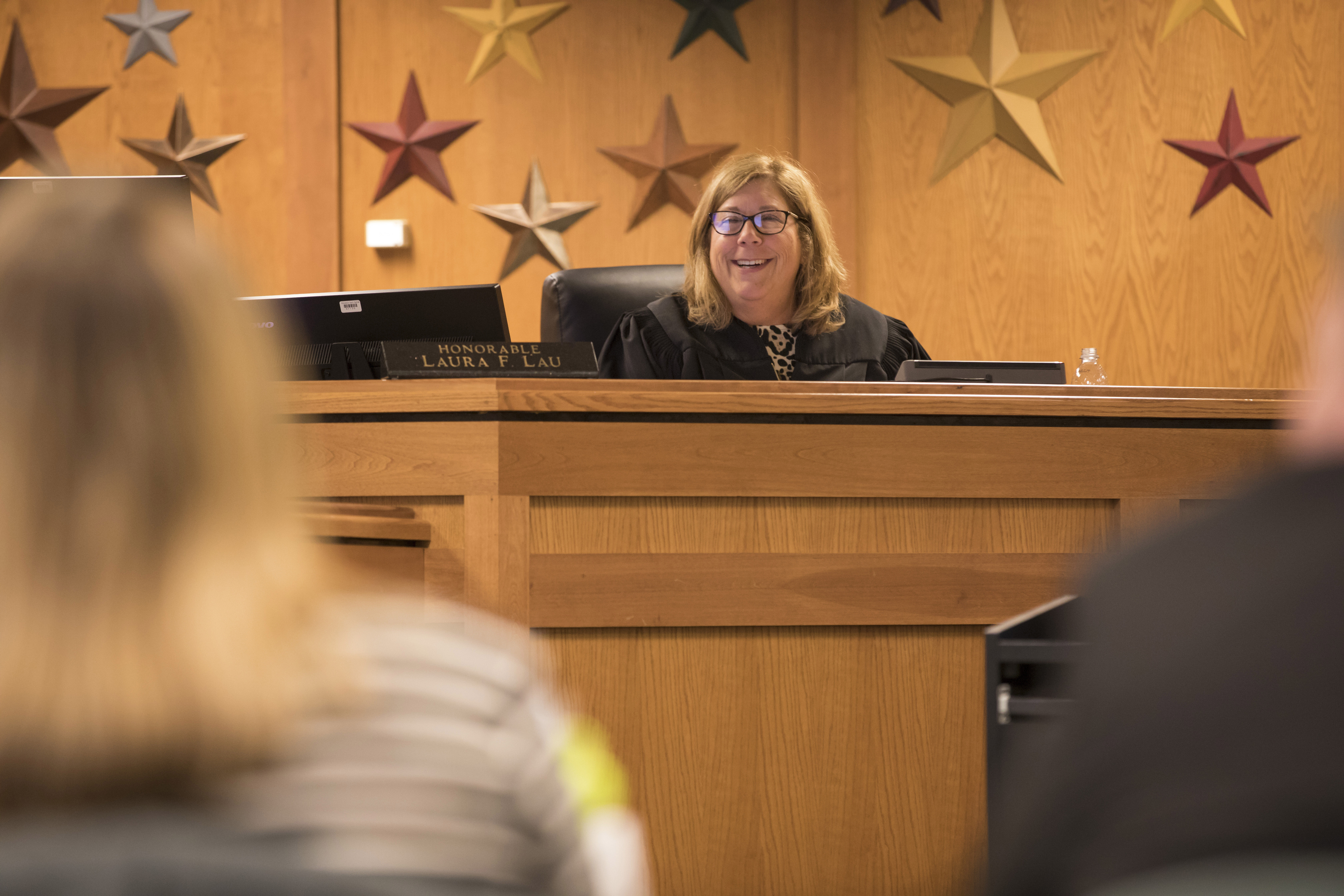 Waukesha County Judge Laura Lau smiles at a Waukesha County OWI Court participant during a hearing Thursday, April 11, 2019. The treatment court is meant as a way to keep drugged and drunken drivers accountable for their actions while also providing the rehabilitation necessary to make them safer, contributing members of society. Photo by Darin Dubinsky/WPR.