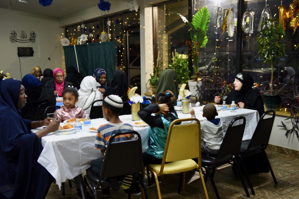 Women and child eat separately from men at the Dawah Center. Photo by Sue Vliet/NNS.