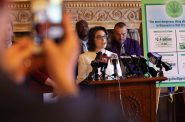 Rep. Melissa Sargent, D-Madison, announces she will introduce a bill to fully legalize marijuana in Wisconsin at the Wisconsin State Capitol in Madison, Wis., on April 18, 2019. She is flanked by, at left, Alan Robinson, executive director of the Wisconsin chapter of NORML; and Bob Daggett, a farmer from Montello, Wis. Sargent introduced the bill on May 17. Photo by Coburn Dukehart/Wisconsin Center for Investigative Journalism.
