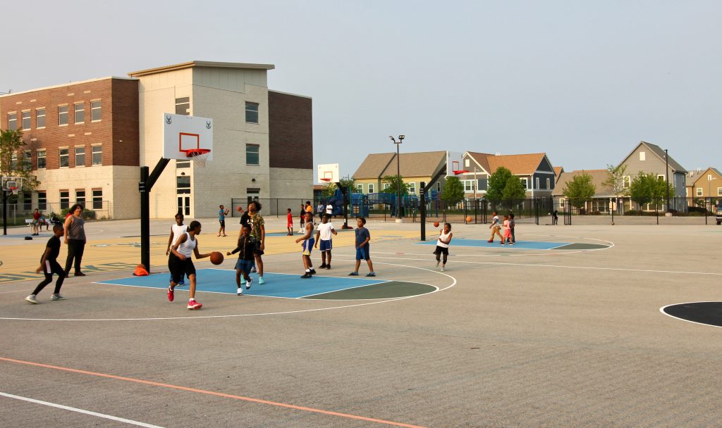 Parks and playgrounds are a vital part of the new Westlawn Gardens. This multi-sport complex at Browning School was funded by the Milwaukee Bucks and Johnson Controls. Photos by Mark Doremus/NNS.