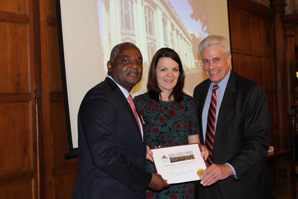 Alderman Robert Bauman (right) presents an award to Milwaukee County Historical Society past board chair Randy Bryant and executive director Mame McCully. Photo from the City of Milwaukee.