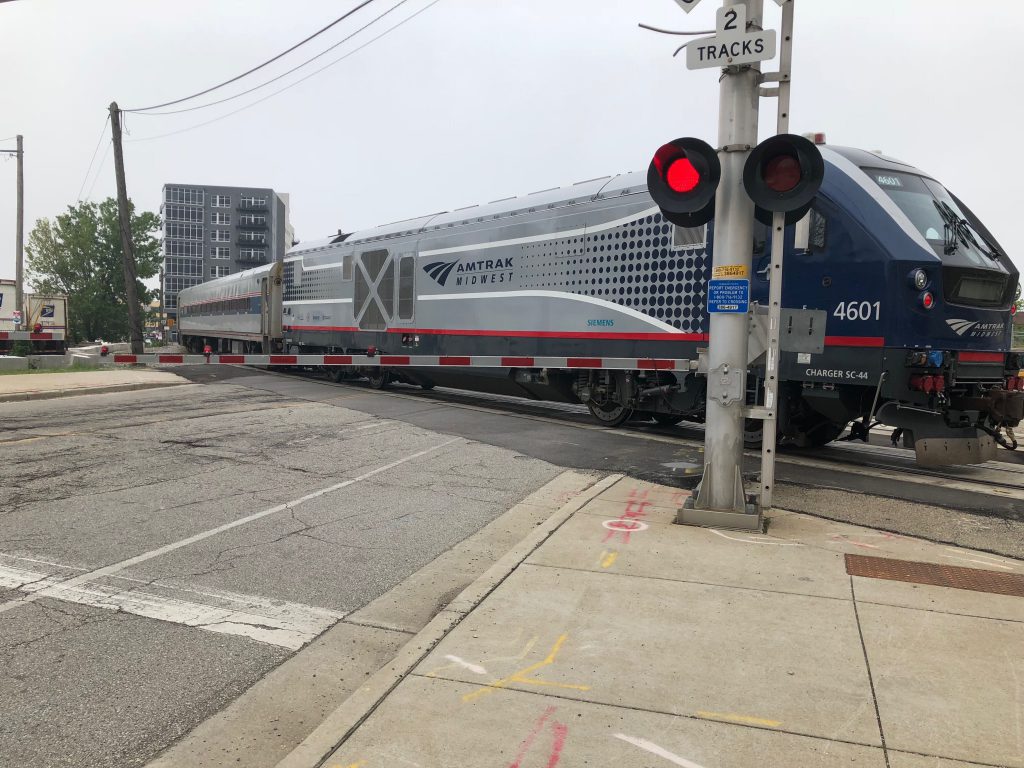 An Amtrak Hiawatha Service train crosses N. Plankinton Ave. near the Milwaukee Intermodal Station. Photo by Jeramey Jannene.