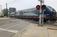 An Amtrak Hiawatha Service train crosses N. Plankinton Ave. near the Milwaukee Intermodal Station. Photo by Jeramey Jannene.