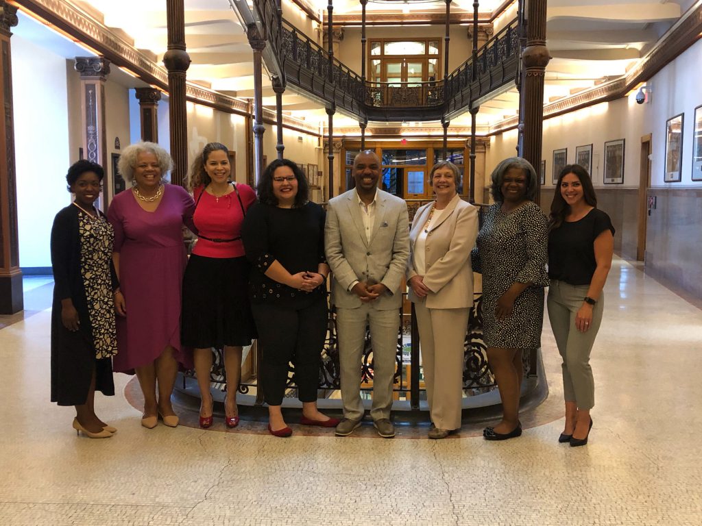 Bria Grant, Julia Means, Commissioner Jeanette Kowalik, Caroline Gomez-Tom, LaNelle Ramey, Dr. Marylyn Ranta, Ericka Sinclair, Ruthie Weatherly at Milwaukee City Hall after the Board of Health confirmation hearings. Photo by Jeramey Jannene.