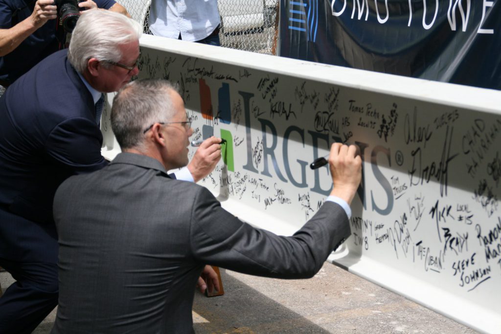 Mark Irgens and Jud Snyder sign the highest beam in BMO Tower. Photo by Jeramey Jannene.