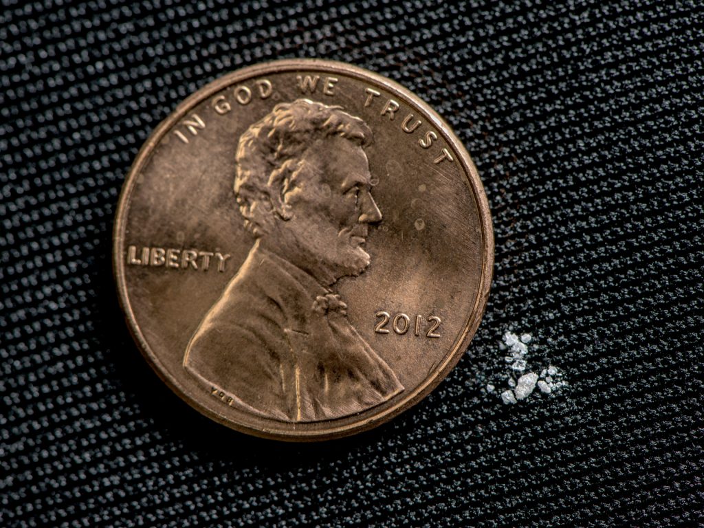 2 mg of Fentanyl (compared to a size of a penny). A lethal dose in most people. Photo from the Drug Enforcement Administration.