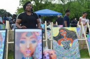 Viola Johnson Riley is pictured with art at the African Cultural Festival. Photo by Jack Fennimore.