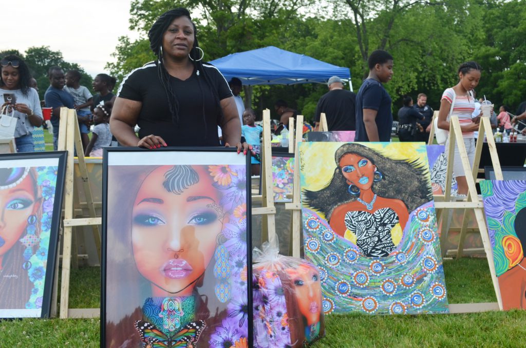 Viola Johnson Riley is pictured with art at the African Cultural Festival. Photo by Jack Fennimore.
