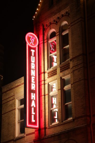 Turner Hall sign lit up at night. Photo from the Pabst Theater Group.