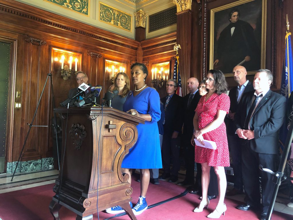 Sen. Lena Taylor, center, speaks at a press conference Wednesday, Aug. 7, 2019 at the state Captiol where Democratic lawmakers introduced bills addressing the reporting of childhood sexual assault. Photo by Laurel White/WPR.