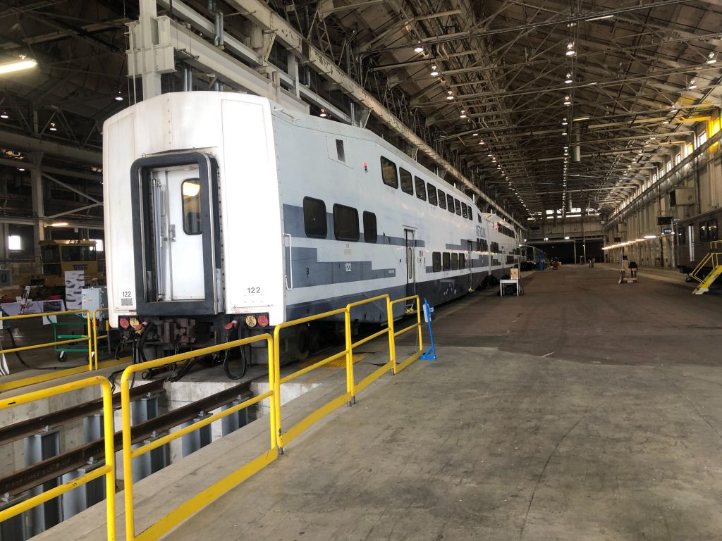 Commuter rail and subway cars awaiting refurbishment in Talgo's Milwaukee facility. Photo by Jeramey Jannene.