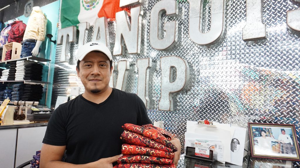 Elias Lopez co-owns El Tianguis VIP, with his father and older brother. His father, Ismael, founded the clothing business 25 years ago. (Photo by Andrea Waxman)