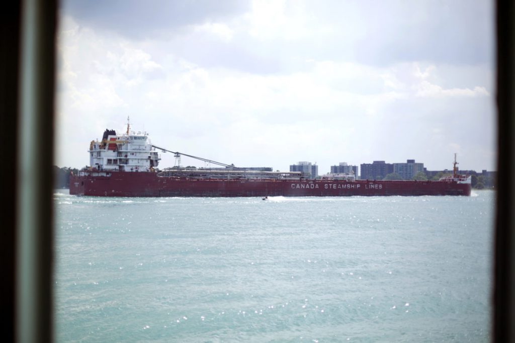 The Whitefish Bay, a 740-foot-long freighter known as a “laker,” owned by Montreal-based Canada Steamship Lines, passes along the Detroit River in Detroit on Aug. 4, 2019. In 2024, Canada will require “lakers” — ships that don’t leave the Great Lakes — to treat ballast water to slow the spread of invasive species. Groups representing U.S. freighters are fighting efforts for similar regulations, claiming it would cost hundreds of millions of dollars. Photo by Anthony Lanzilote / Bridge Magazine.