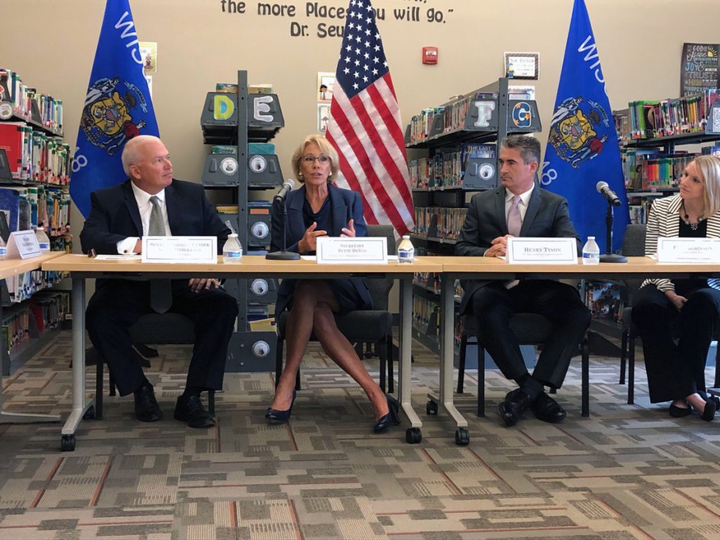 U.S. Secretary of Education Betsy DeVos, second to left, kicks off her back-to-school tour at St. Marcus School in Milwaukee on Sept. 16, 2019. She was joined by, from left to right, state Sen. Scott Fitzgerald, R-Juneau, St. Marcus Lutheran School Superintendent Henry Tyson, and St. Marcus Lutheran School principal Erin Johnson. Corrinne Hess/WPR.