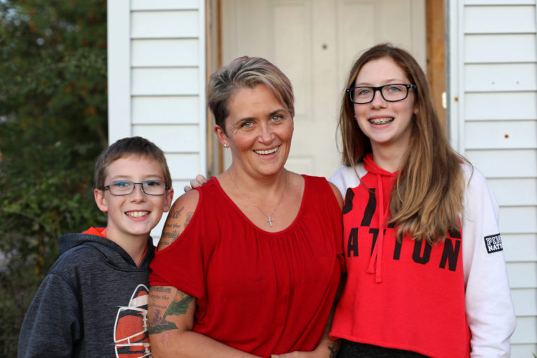 Jess Przybylski started using methamphetamine after the father of her children died in a car crash. During a five-year period, she lost custody of her two children twice, plus her job, cars and relationships. After completing intensive treatment in 2016 as a condition of her sentence, she got her children back. She is now an advocate for meth recovery and a member of the Take a Stand Against Meth Campaign, a community initiative in Chippewa County, Wis. Przybylski is pictured outside of her home in Chippewa Falls with her children Zander, left, and Peyton. Photo taken Sept. 25, 2019. Photo by Parker Schorr / The Cap Times.