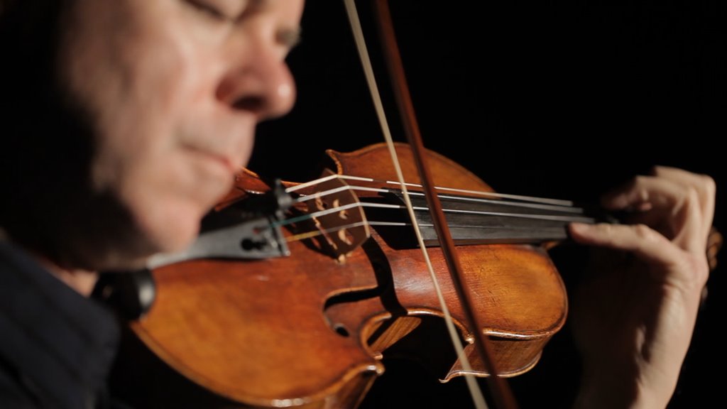 Frank Almond playing the Lipinski Stradivarius violin. Image from Milwaukee Film Festival.