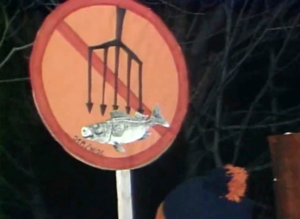 A sign displays opposition to Ojibwe spearfishing treaty rights, as seen at a protest during the "Walleye Wars," which played out in Wisconsin during the late 1980s and early 1990s. Image from The Ways/PBS Wisconsin Education.