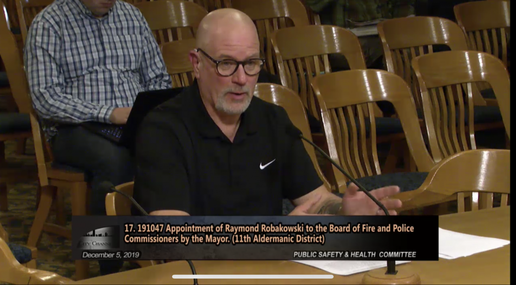 Raymond Robakowski speaks before the Public Safety and Health Committee. Image from the City of Milwaukee.