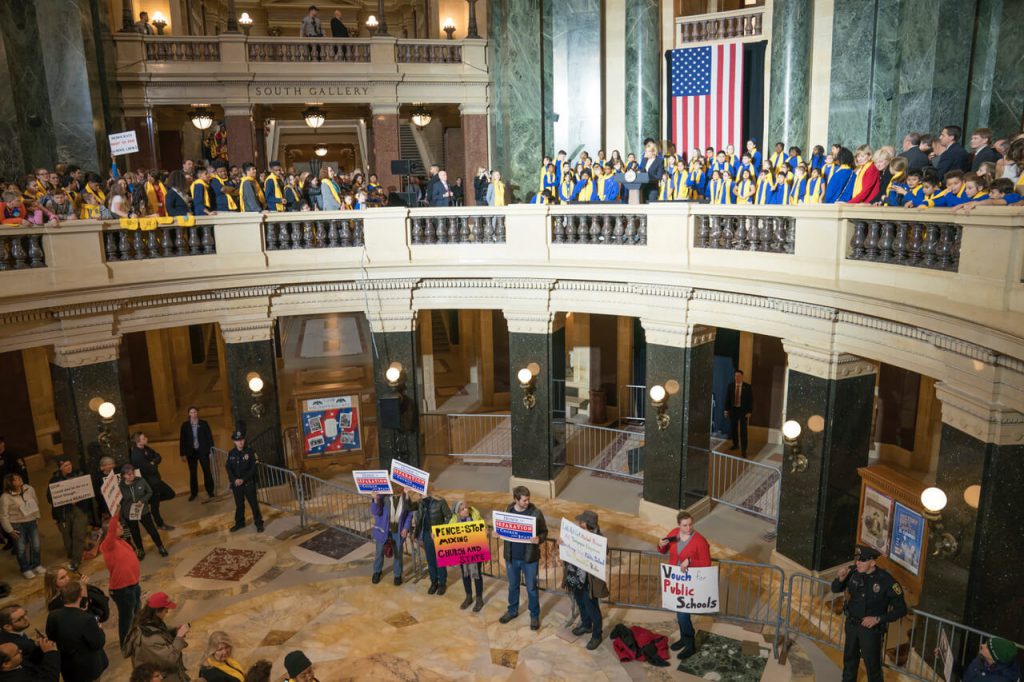 Education Secretary Betsy DeVos speaks at the Capitol in Madison, Wisconsin during School Choice Week as protesters gather in the rotunda below. Photo by Luther Wu/Wisconsin Examiner.