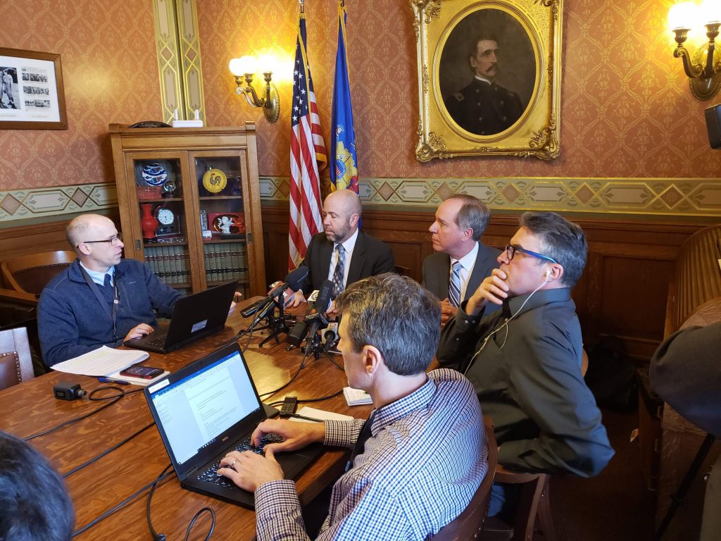 At the head of the table, Majority Leader Rep. Jim Steineke (R-Kaukauna), left, and Speaker Robin Vos (R-Rochester) speak with reporters before Wednesday's Assembly floor session. Photo by Erik Gunn/Wisconsin Examiner.