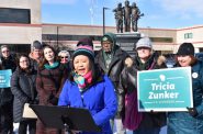 Ka Lo, a member of the Marathon County Board in Wausau, spoke about the Trump administration's immigration policies at a Feb. 13 rally in the city. Photo by Rob Mentzer/WPR.