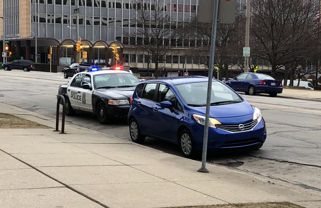 A Milwaukee Police Department officer pulls over a driver on N. Broadway. Photo by Jeramey Jannene.