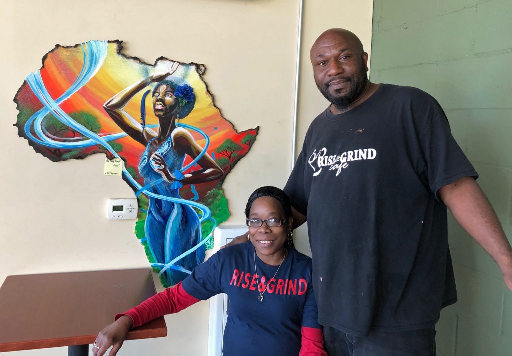 Corey Strong, right, was a political junkie and history major in college. But disinterest kept him from voting in 2016. Strong is pictured here with Michelle Patrick at Rise and Grind Cafe in Milwaukee. Photo by Corrinne Hess/WPR.