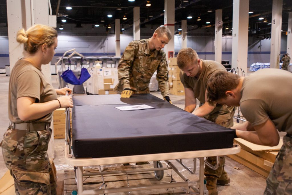 Hospital bed being setup in McCormick Place. U.S. Air Force file photo by Senior Airman Jay Grabiec