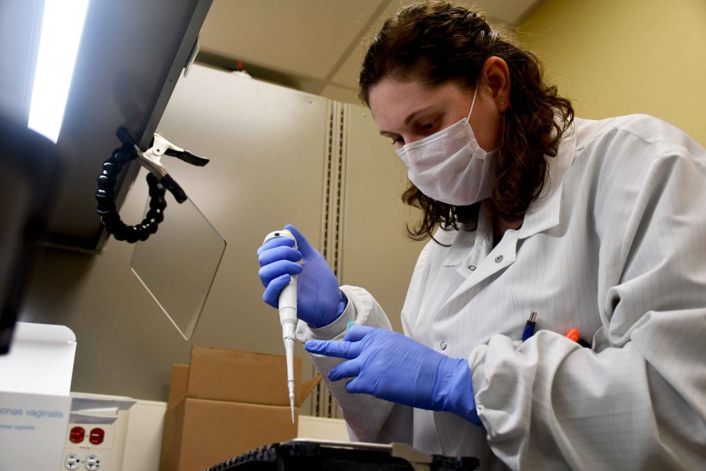 Aspirus Wausau Hospital Medical Technologist Lindsey Koski begins a COVID-19 batch testing process. Photo courtesy of Aspirus.