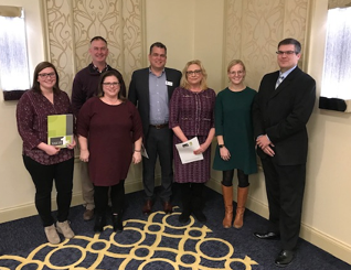 Left to Right: Ellen Thompson, Heritage of Elmwood; Pete Eide, Bethel Home; Jennifer Brieske, Morrow Home; David Merkley, Miravida Living; Elizabeth Toohill, Maplewood Health Center; Taylor Goodland, formerly of American Lutheran Home; Jason Schaufenbuel, West Bend Mutual Insurance Co. (not pictured: School Sisters of St. Francis-Sacred Heart). Photo courtesy of West Bend Mutual.