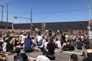 Group of protesters sitting at Mitchell Street. Photo by Jeramey Jannene.