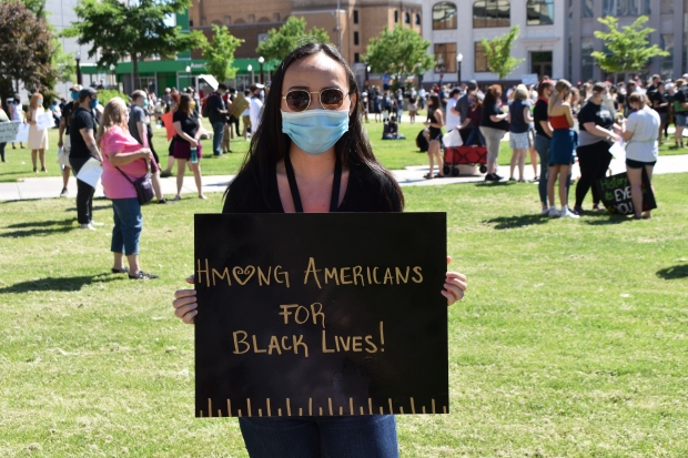 Felysity Niles of Wausau holds a sign reading "Hmong Americans for Black Lives" at the George Floyd March on June 6, 2020. Rob Mentzer/WPR
