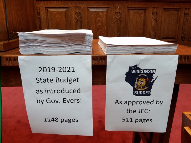 Republicans stacked a paper copy of Gov. Tony Evers' budget bill next to their own on the day the Wisconsin Assembly passed its version of a two-year spending plan. The GOP budget bill is the shortest in decades. Shawn Johnson/WPR