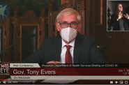 Wearing a protective mask as recommended by public health experts to reduce the spread of COVID-19, Gov. Tony Evers addresses reporters in a telephone and live-streamed news conference Thuesday, July 7. (Screenshot from Youtube)