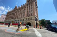 Repainting the "Defund the Police" mural. Photo by Graham Kilmer.