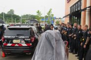 Wauwatosa officers form a line in front of Mayfair Mall’s Cheesecake Factory. A few protesters had just been arrested. Photo by Isiah Holmes/Wisconsin Examiner.