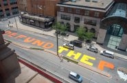“Defund the police” is seen painted across a block of North Water Street in Milwaukee on July 2, 2020. The Milwaukee Department of Public Works removed the paint a week later, saying it presented “serious traffic safety concerns” because it covered traffic markings and was slick when wet. “The message painted on Water Street has been heard loud and clear by policy makers in city government, and the Department of Public Works has no intention to diminish the voices calling for change,” Commissioner of Public Works Jeff Polenske said in a July 9 statement. “Our concern for unauthorized street art including the current mural on Water Street is solely about safety.” Will Cioci/Wisconsin Watch.
