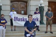 Madison nurse Kate Walton speaks about the importance of wearing a mask to prevent the spread of COVID-19, at a news conference outside the state Capitol Thursday urging lawmakers not to override Gov. Tony Evers' mask order. Photo by Erik Gunn/Wisconsin Examiner.
