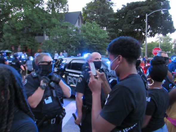 Wauwatosa officers confront protesters in the days after the incident at Mensah’s house. Photo by Isiah Holmes/Wisconsin Examiner.