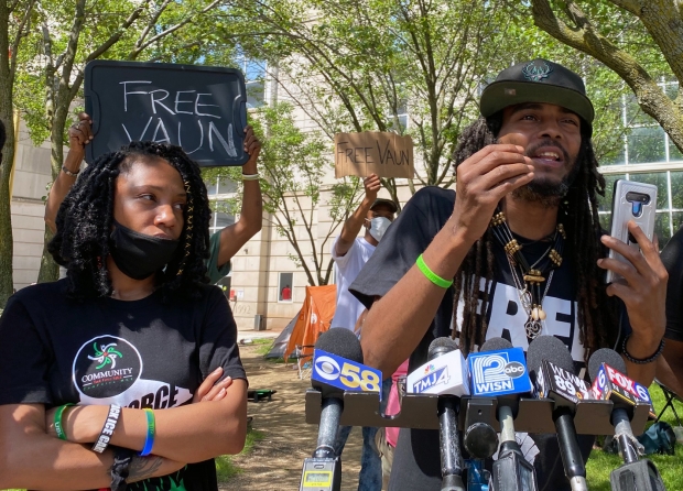 Milwaukee activists Gabi Taylor, left, and Frank Nitty speak during a June 30, 2020 press conference following the arrest of Vaun Mayes. Nitty and Mayes are two of the protesters who are currently marching to Washington D.C. Corrinne Hess/WPR