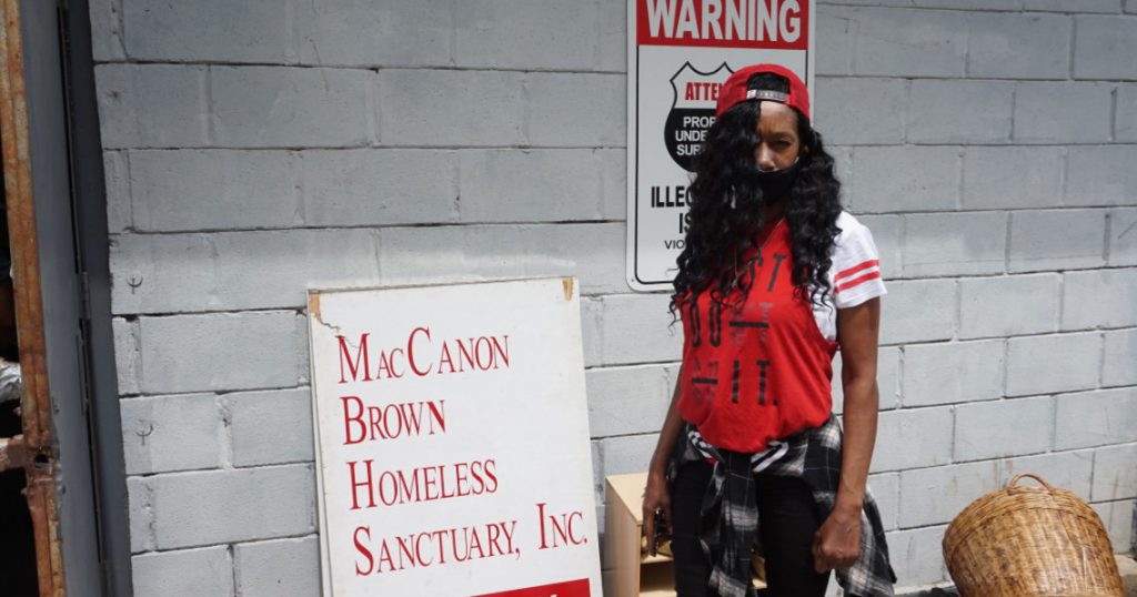 Diane Green, a 54-year-old resident of Milwaukee’s Northwest Side, stands outside the MacCanon Brown Homeless Sanctuary, 2461 W. Center St., as she waits for a fan. The agency distributed hundreds of fans to residents in the 53206 ZIP code this summer. Photo courtesy of NNS.