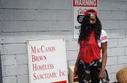 Diane Green, a 54-year-old resident of Milwaukee’s Northwest Side, stands outside the MacCanon Brown Homeless Sanctuary, 2461 W. Center St., as she waits for a fan. The agency distributed hundreds of fans to residents in the 53206 ZIP code this summer. Photo courtesy of NNS.