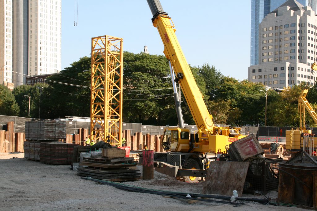 The tower crane is being assembled for the Ascent apartment tower. Photo by Jeramey Jannene.